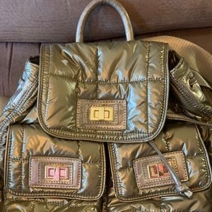 Steve Madden Backpack. In Excellent Condition. Gold color.